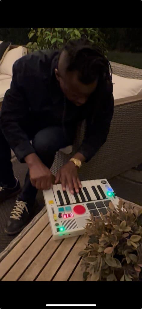 Playing The Beat Brick on a backyard table at night