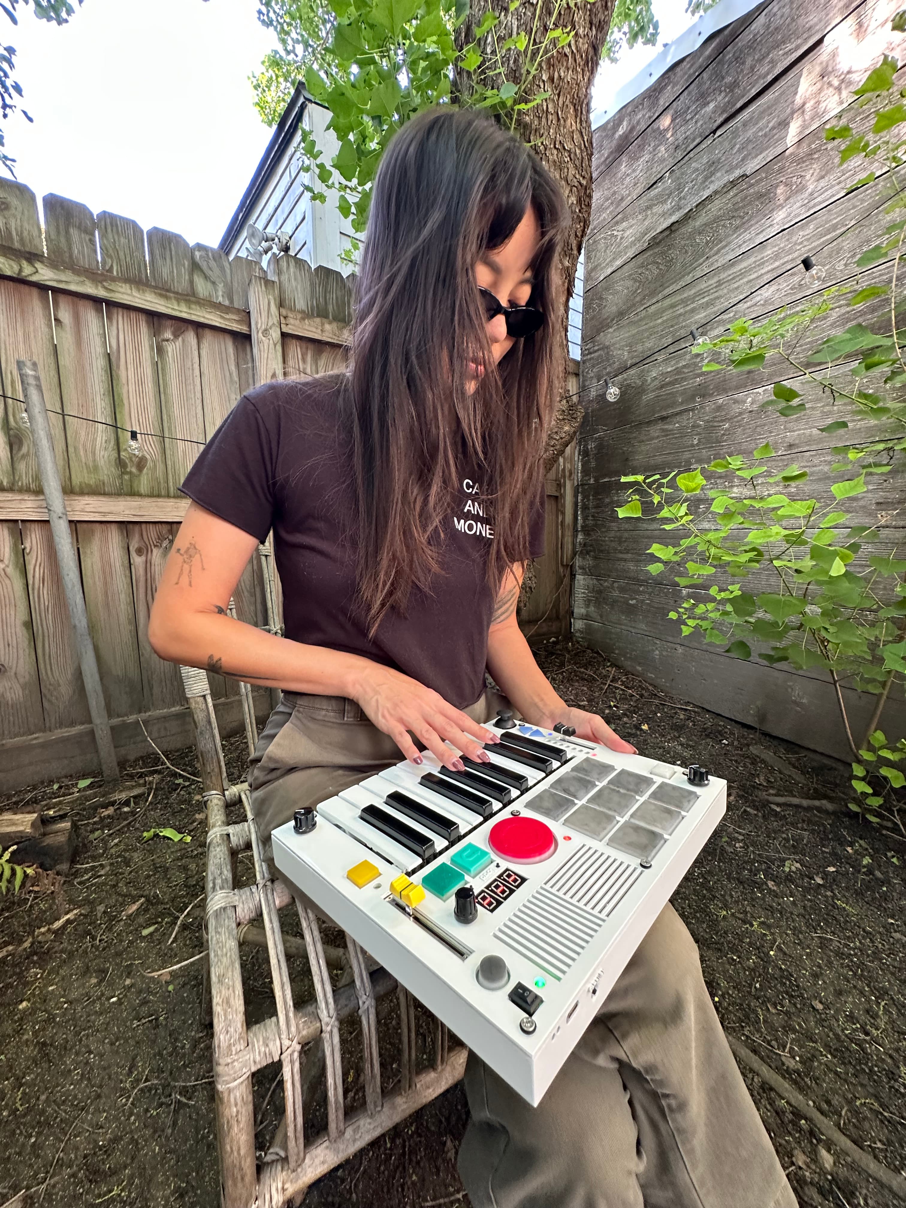 Playing The Beat Brick while sitting in a garden chair