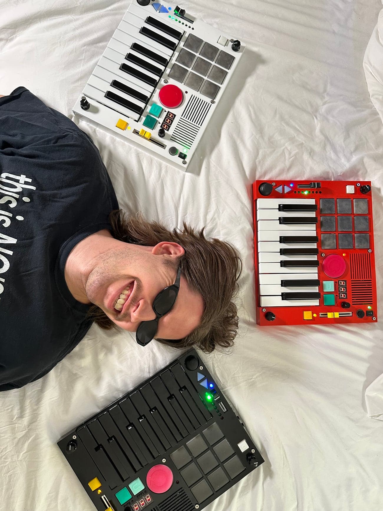 Connor surrounded by three Beat Brick machines